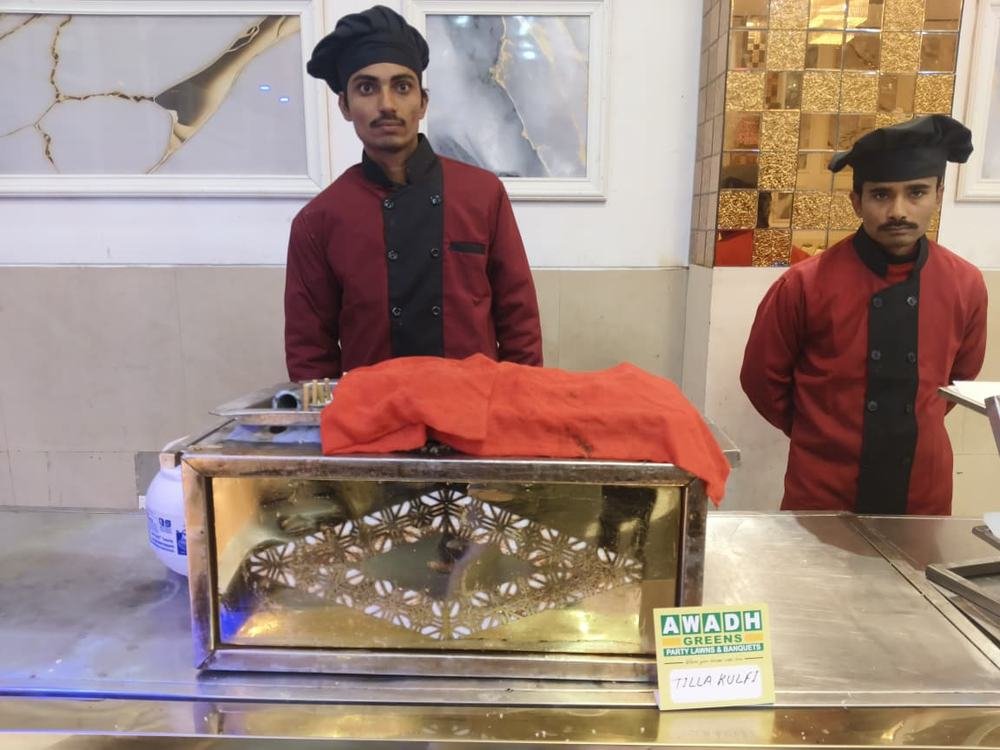 Chefs in uniform at a service counter