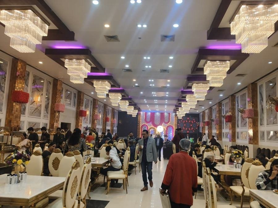 Row of crystal chandeliers along the hall ceiling